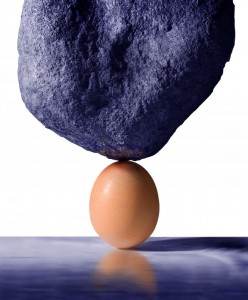 an-egg-supports-the-weight-of-a-large-boulder-in-a-surreal-and-unlikely-scenario-mal-bray